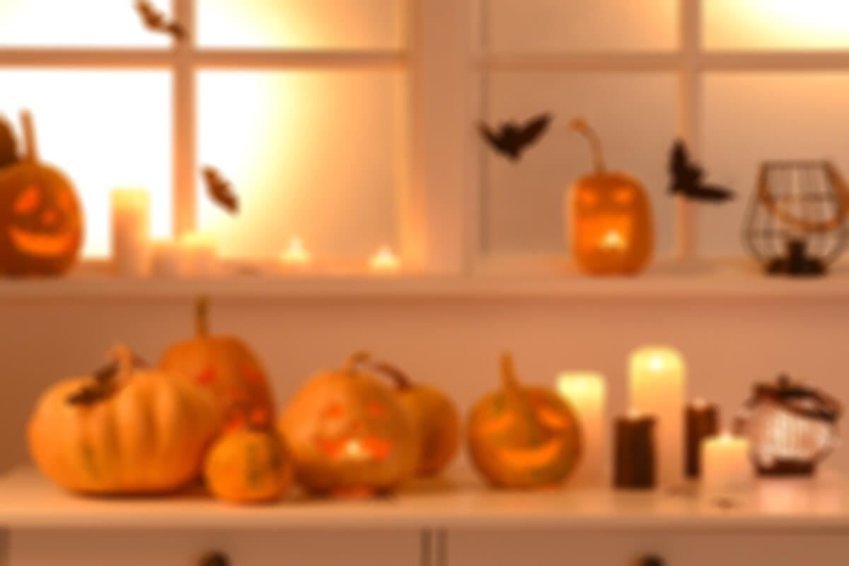 fond photo halloween avec citrouille et bougies cosy et chauve souris
